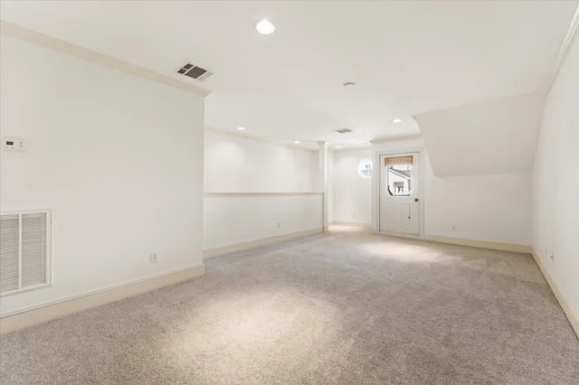 an empty room with a empty space and windows