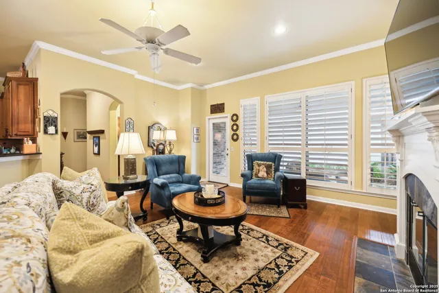 a living room with furniture and a fireplace