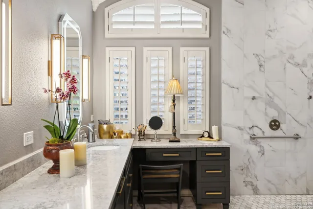 a bedroom with two beds and a chandelier