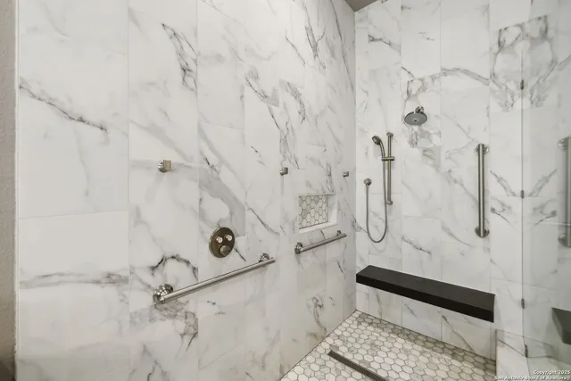 a view of a backyard with plants and large trees