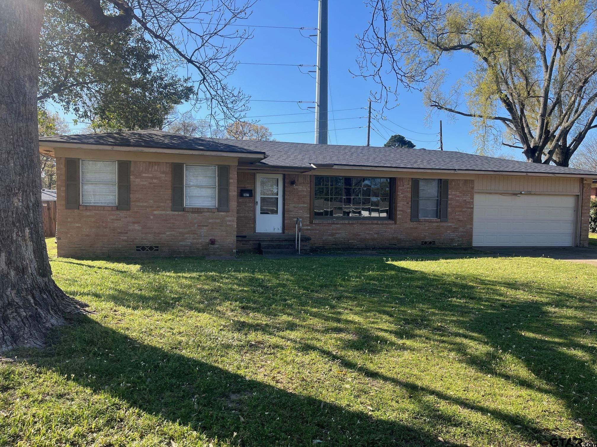 a view of a house with a garden