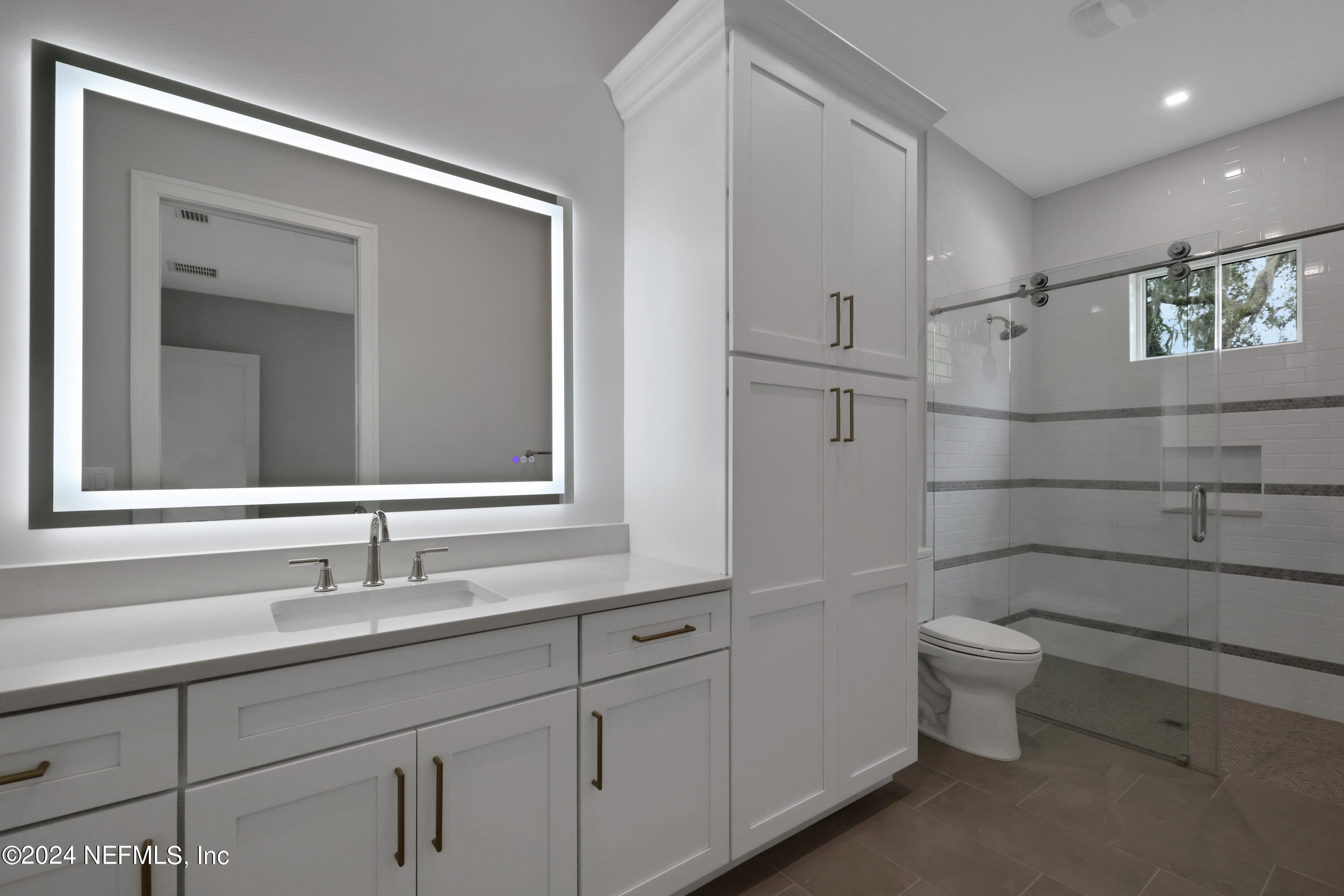 149 Marshall Creek Drive St. Augustine, FL 32095 - Photo 43 of 91 a bathroom with a double vanity sink toilet and a mirror