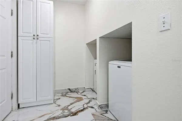 a view of a livingroom with table and chair