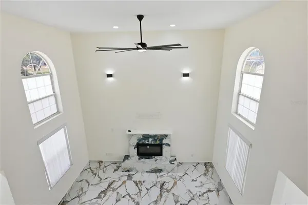 a view of empty room with windows