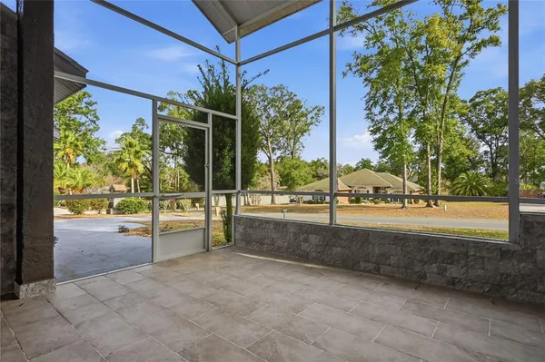 a view of yard with patio