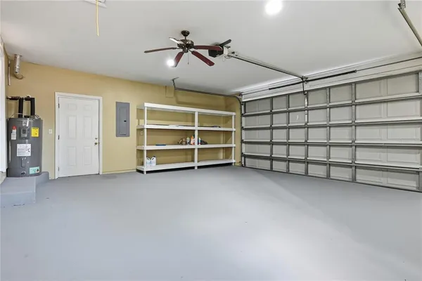 a view of an empty room with a ceiling fan