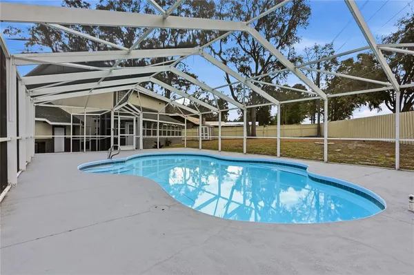 a view of a swimming pool with a porch