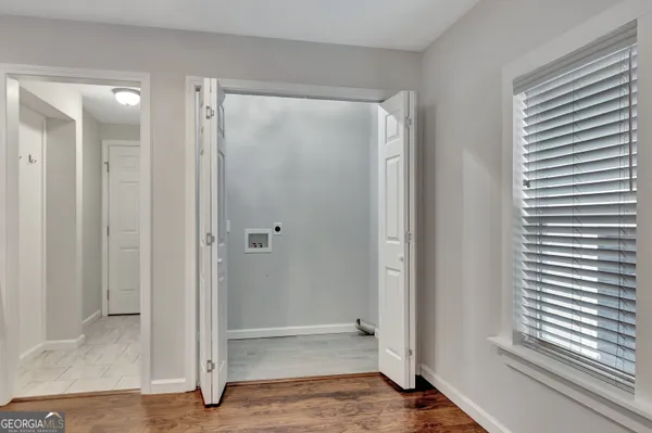 a bedroom with furniture and wooden floor