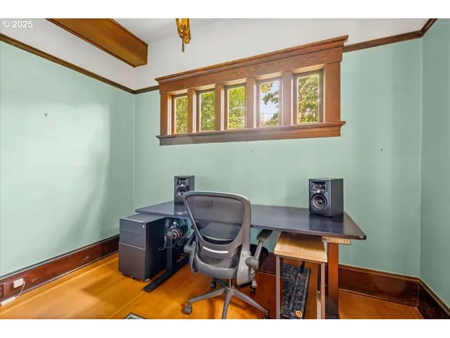 a kitchen with stainless steel appliances kitchen island granite countertop a table chairs in it and a view of living room