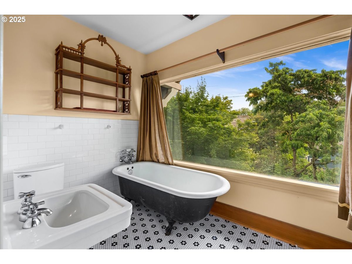 1844 Southeast 12th Avenue Portland, OR 97214 - Photo 20 of 48 a bathroom with a sink toilet and mirror