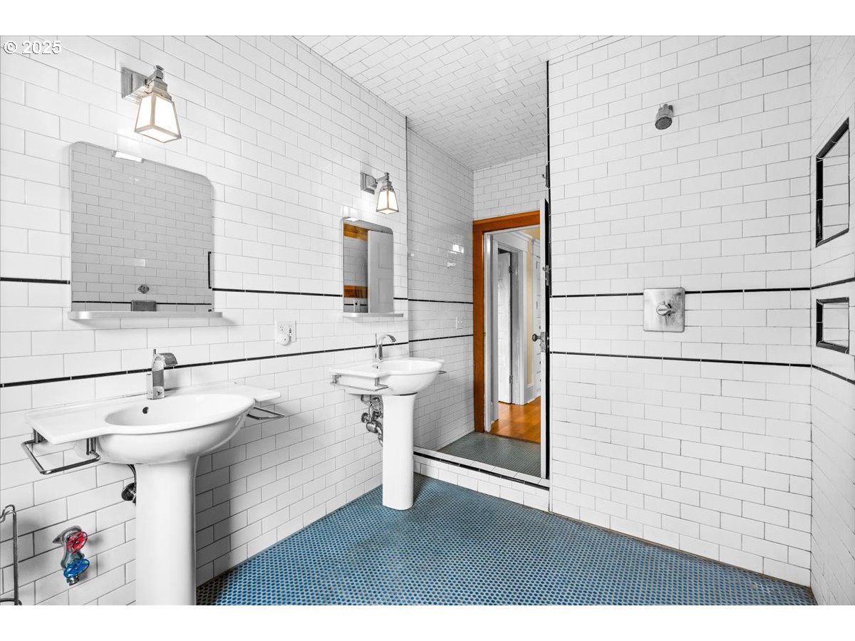 1844 Southeast 12th Avenue Portland, OR 97214 - Photo 26 of 48 a bathroom with a sink a toilet and shower