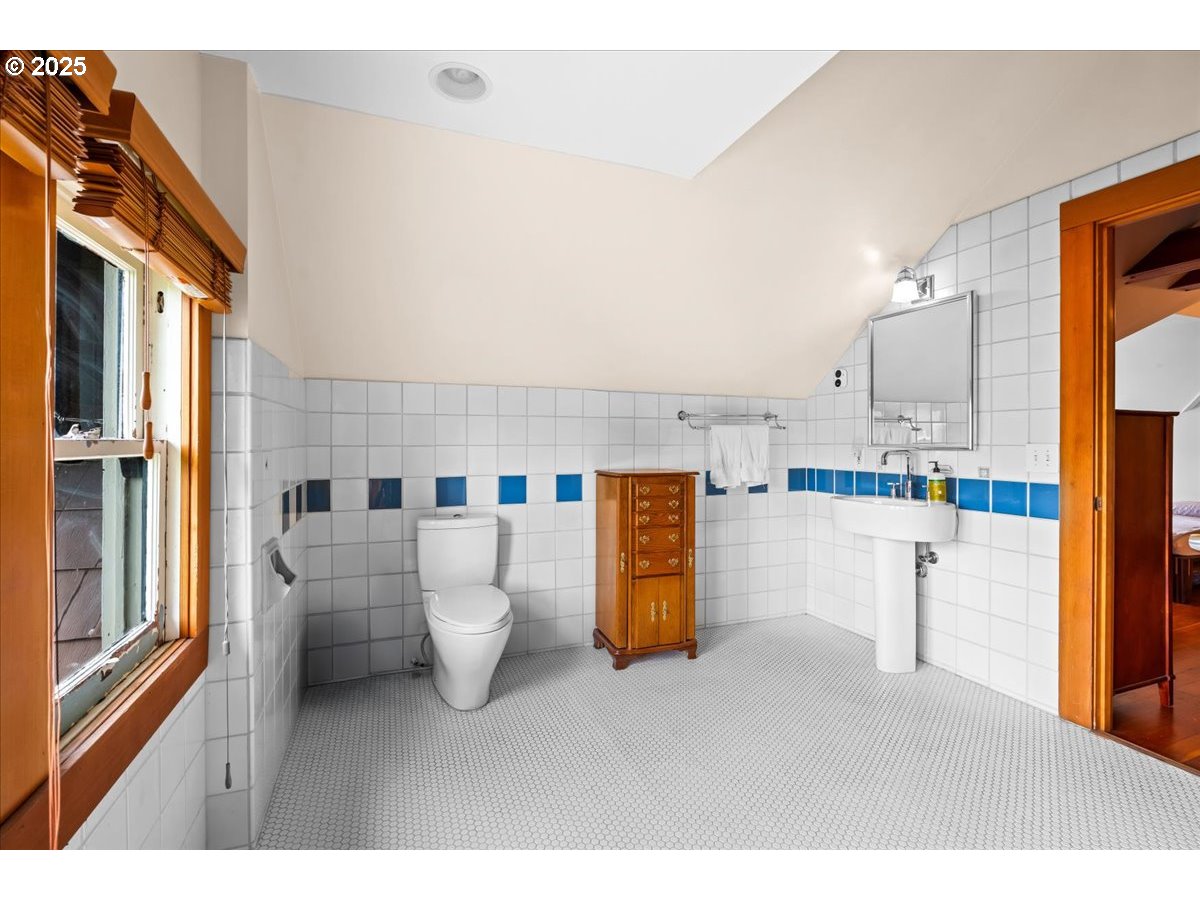 1844 Southeast 12th Avenue Portland, OR 97214 - Photo 30 of 48 a open kitchen with a refrigerator and white cabinets
