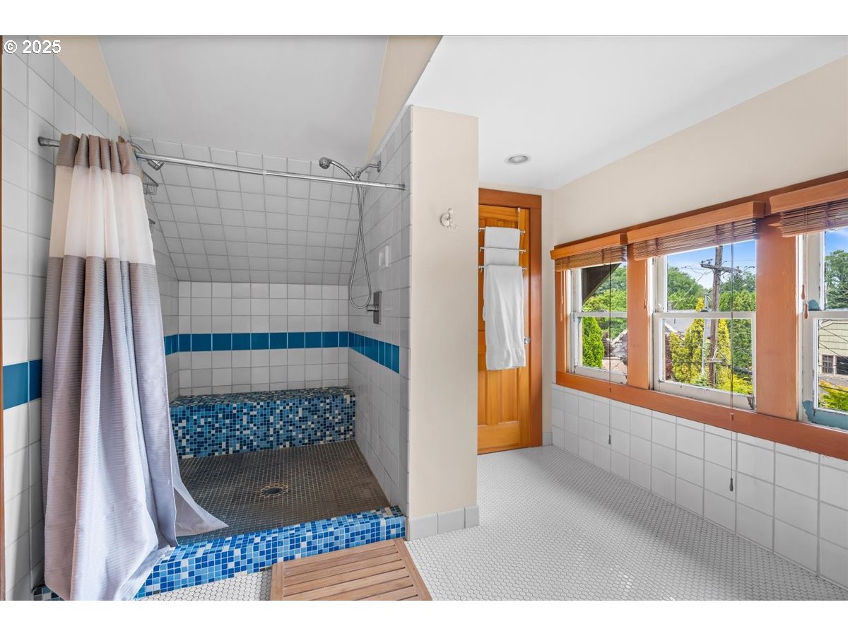 1844 Southeast 12th Avenue Portland, OR 97214 - Photo 31 of 48 a view of hallway with a large window and wooden floor