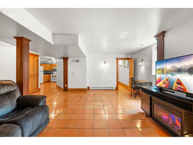 a kitchen with a sink a stove top oven and cabinets
