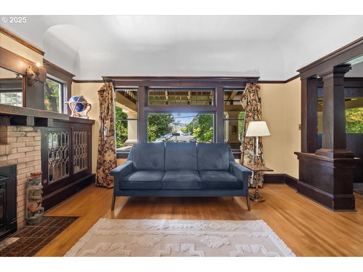 1844 Southeast 12th Avenue Portland, OR 97214 - Photo 8 of 48 a living room with furniture and a fireplace