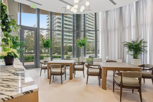 a large white kitchen with a large window