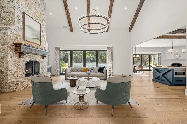 a kitchen with stainless steel appliances kitchen island granite countertop a stove a sink and a refrigerator