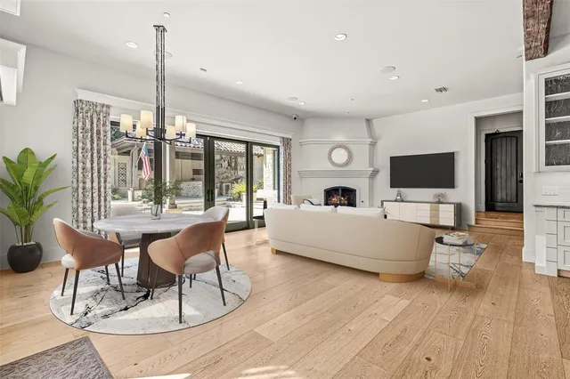 a kitchen with stainless steel appliances a sink cabinets and wooden floor