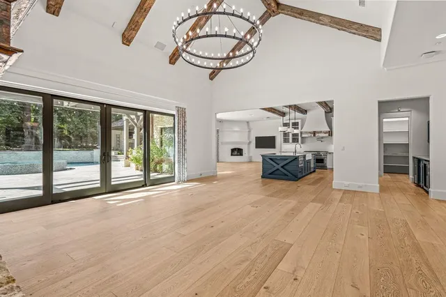 a kitchen with stainless steel appliances granite countertop a stove and a white cabinets