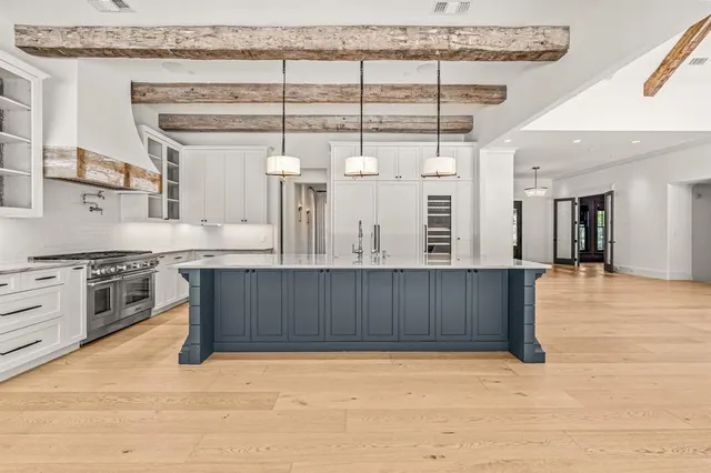 a kitchen with stainless steel appliances granite countertop a stove and a sink