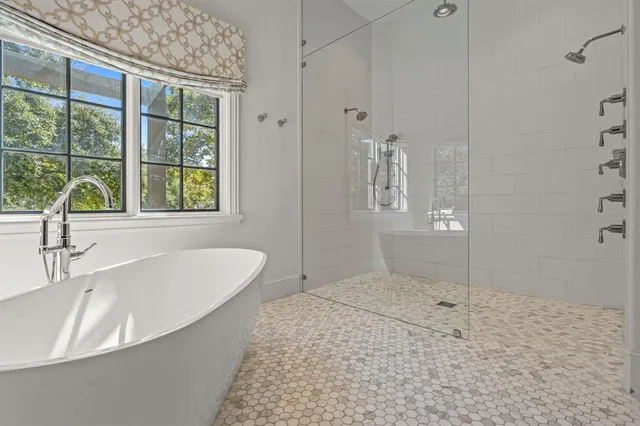 an aerial view of a house with garden space and street view