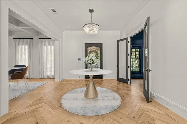 a living room with furniture a fireplace and a floor to ceiling window