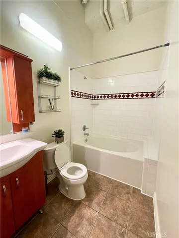 a bathroom with a sink a toilet and a bathtub
