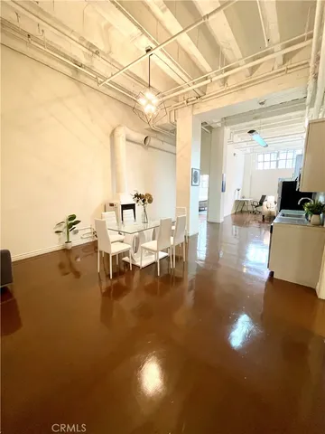 a lobby with furniture and floor to ceiling windows