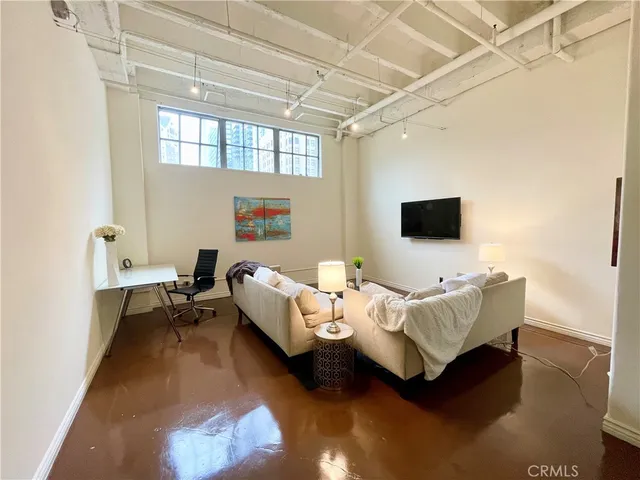 a room with furniture and a flat screen tv