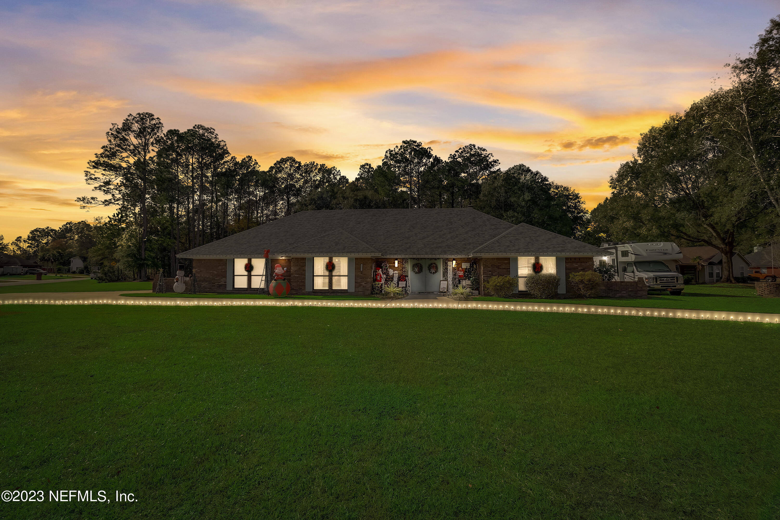 55377 Deer Run Road Callahan, FL 32011 - Photo 1 of 47 a view of house with garden space and trees