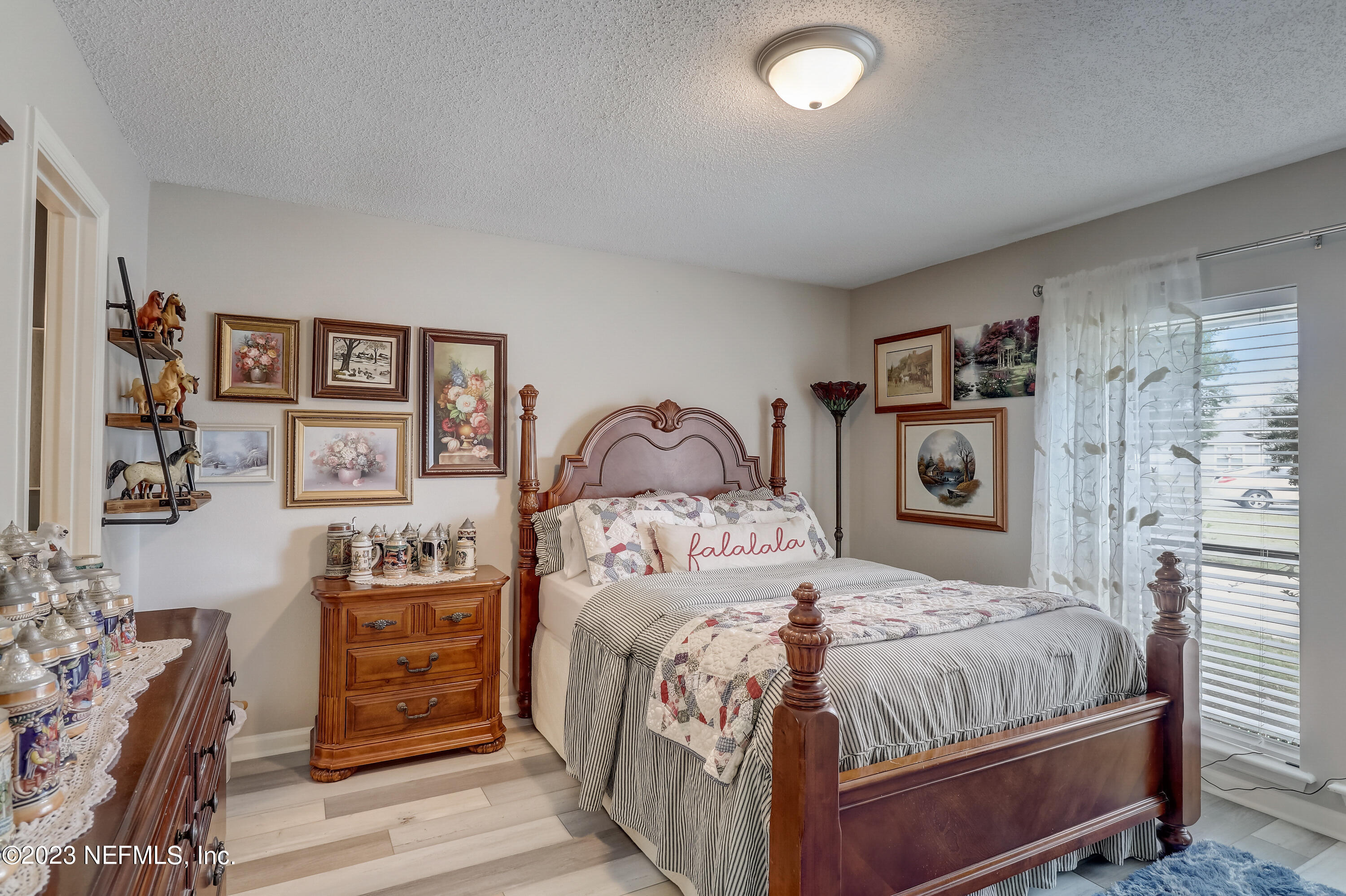 55377 Deer Run Road Callahan, FL 32011 - Photo 14 of 47 a bedroom with a bed and a painting on the wall