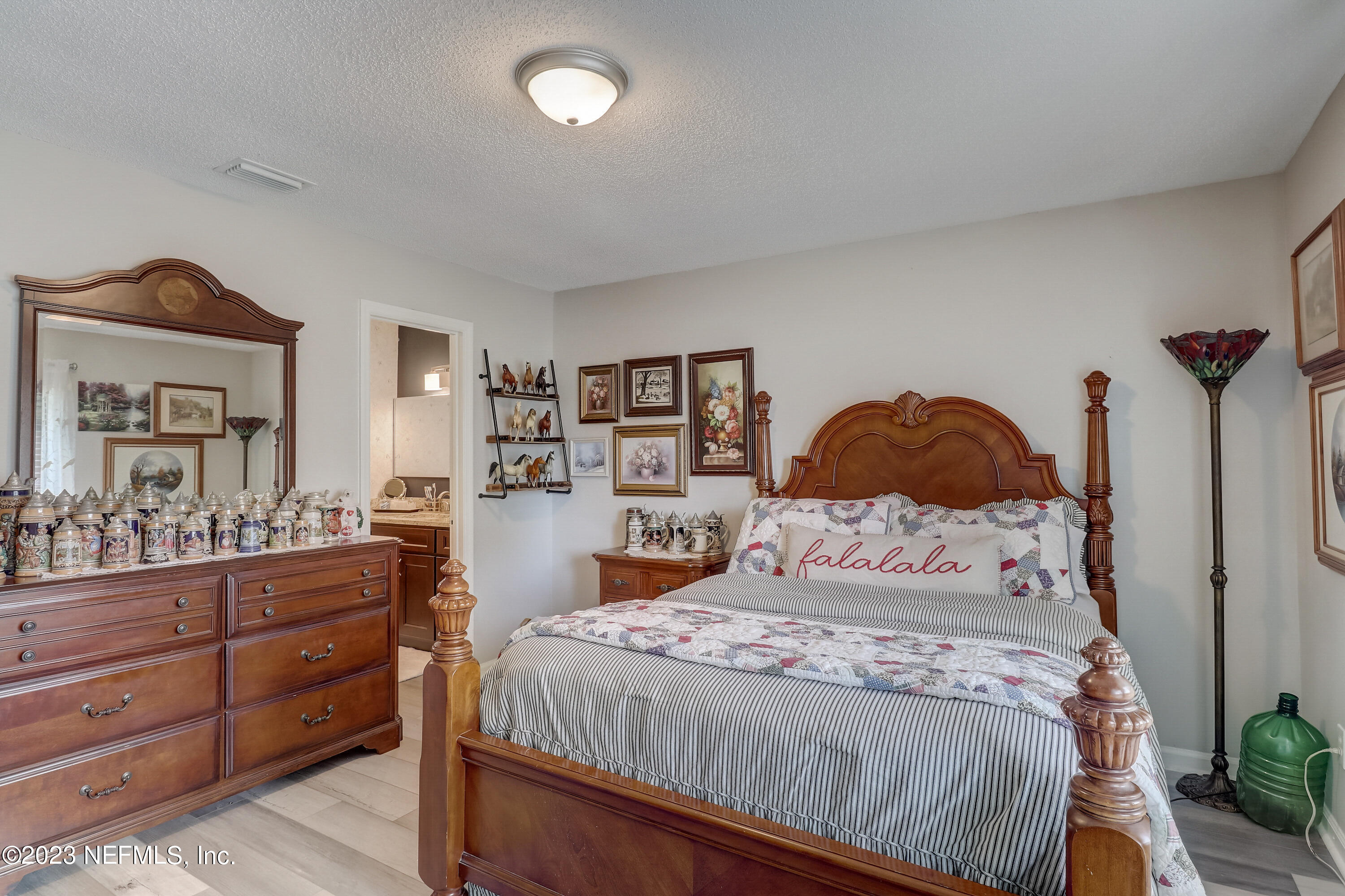 55377 Deer Run Road Callahan, FL 32011 - Photo 15 of 47 a bedroom with a bed and a cabinets
