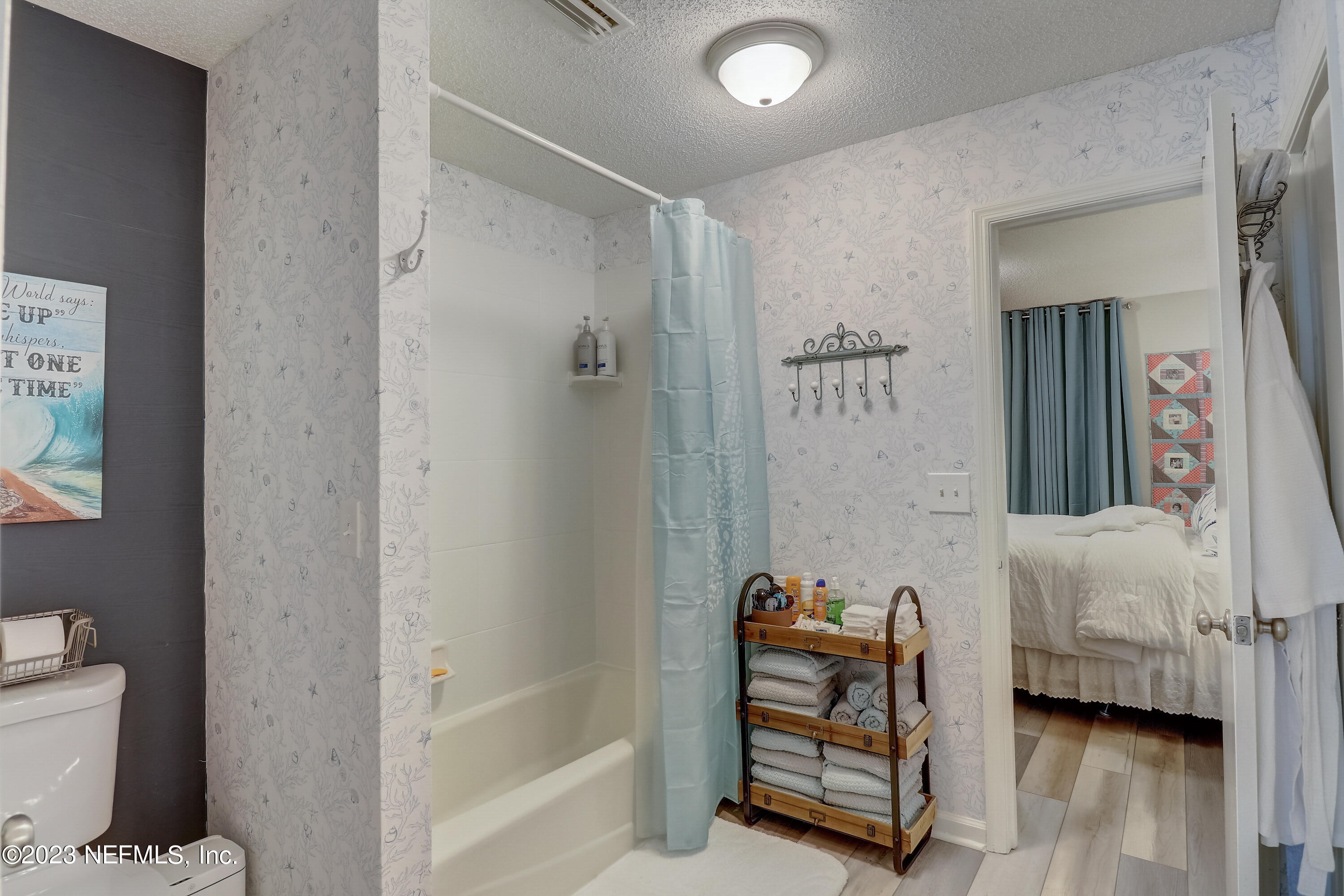 55377 Deer Run Road Callahan, FL 32011 - Photo 17 of 47 a bathroom with a tub and a shower