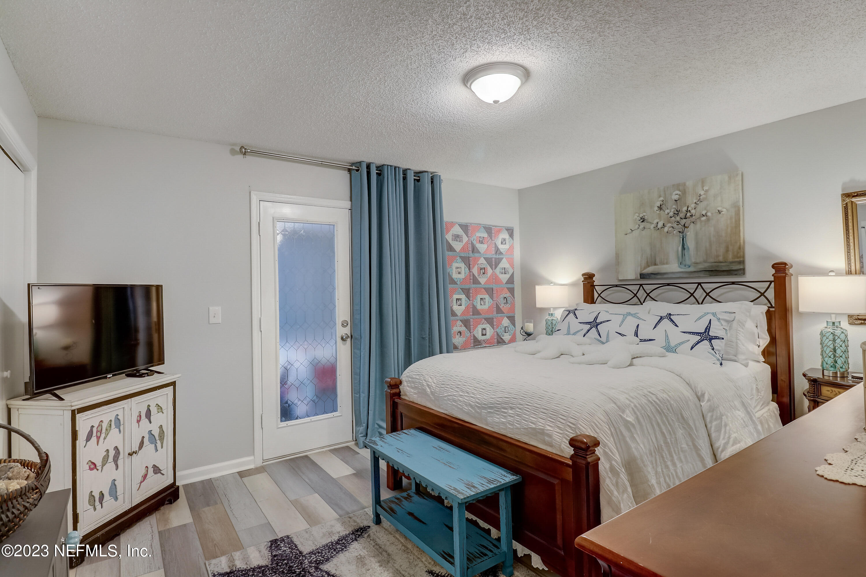 55377 Deer Run Road Callahan, FL 32011 - Photo 19 of 47 a bedroom with a bed and a flat screen tv