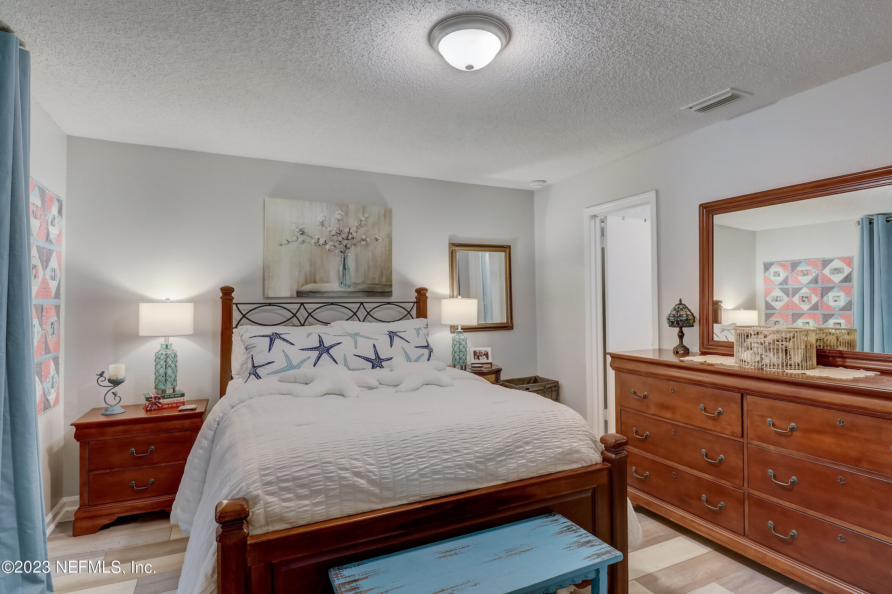 55377 Deer Run Road Callahan, FL 32011 - Photo 20 of 47 a bedroom with a bed and a dresser in it
