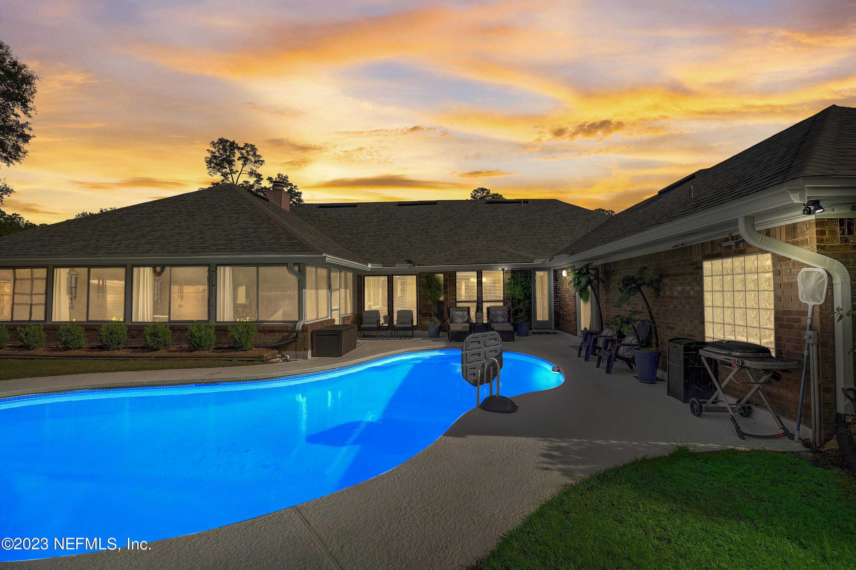 55377 Deer Run Road Callahan, FL 32011 - Photo 2 of 47 a view of a house with swimming pool and porch
