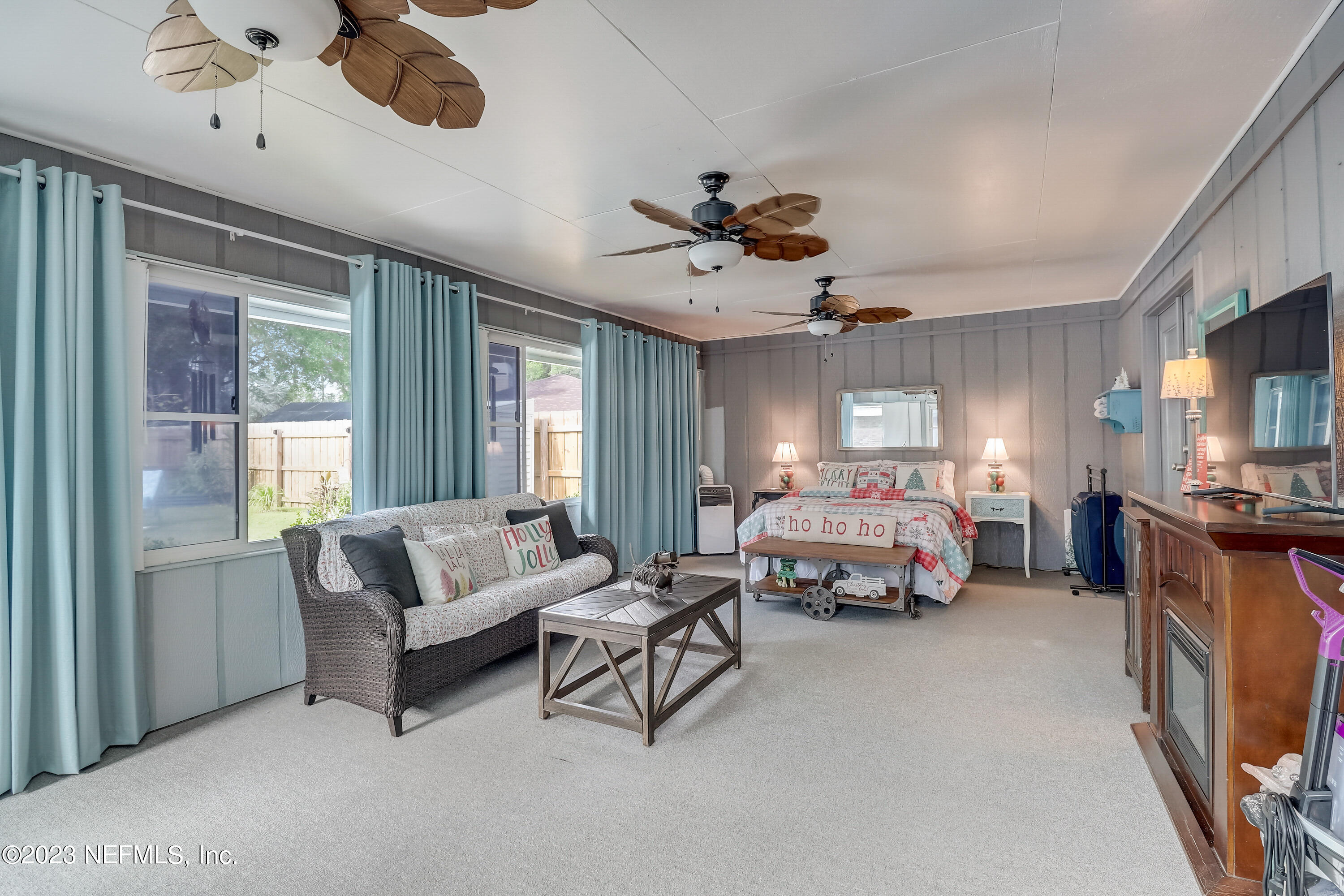 55377 Deer Run Road Callahan, FL 32011 - Photo 21 of 47 a bedroom with furniture and a large window