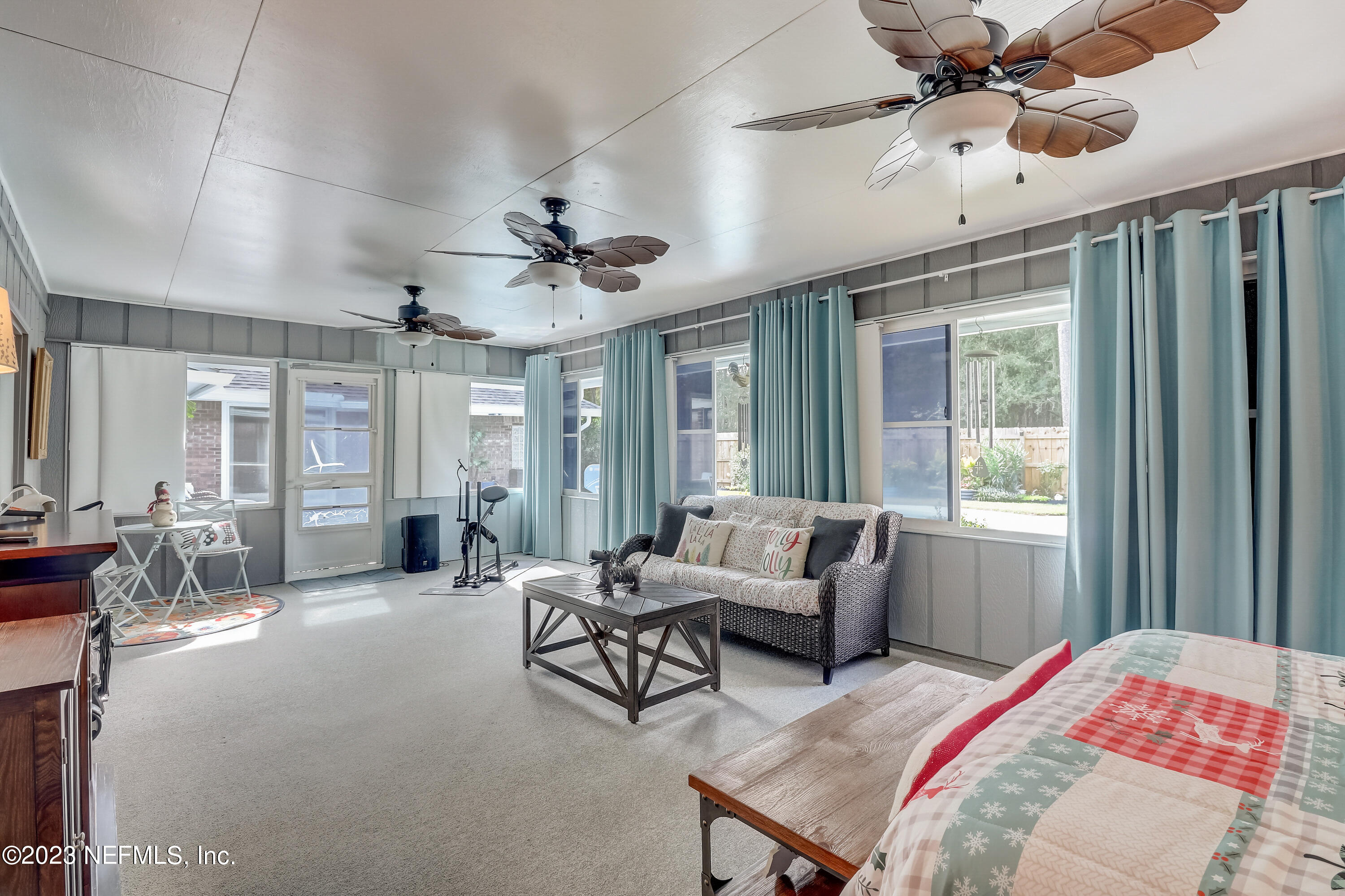 55377 Deer Run Road Callahan, FL 32011 - Photo 22 of 47 a living room with furniture ceiling fan and a window