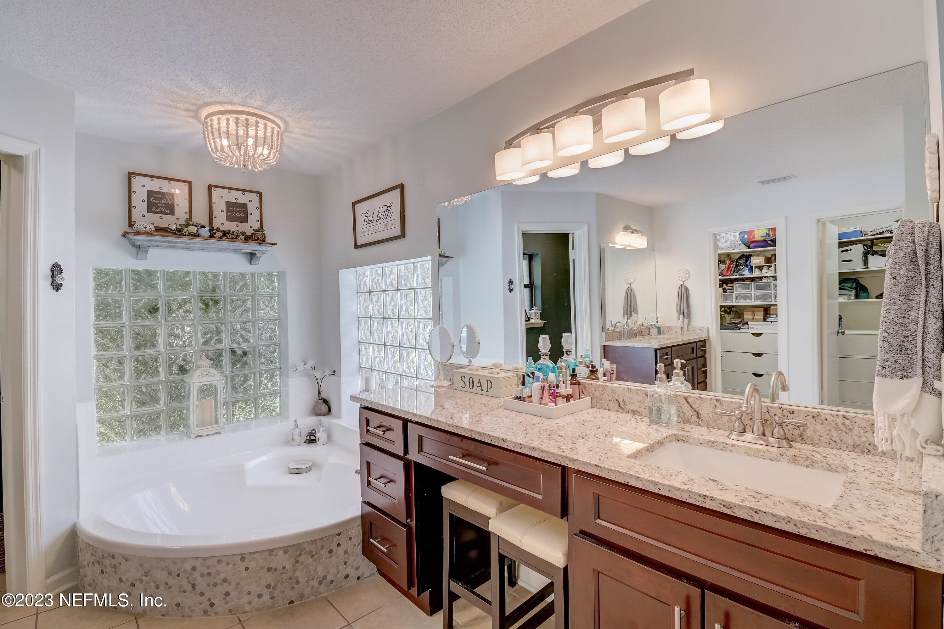 55377 Deer Run Road Callahan, FL 32011 - Photo 27 of 47 a bathroom with a tub sink and mirror