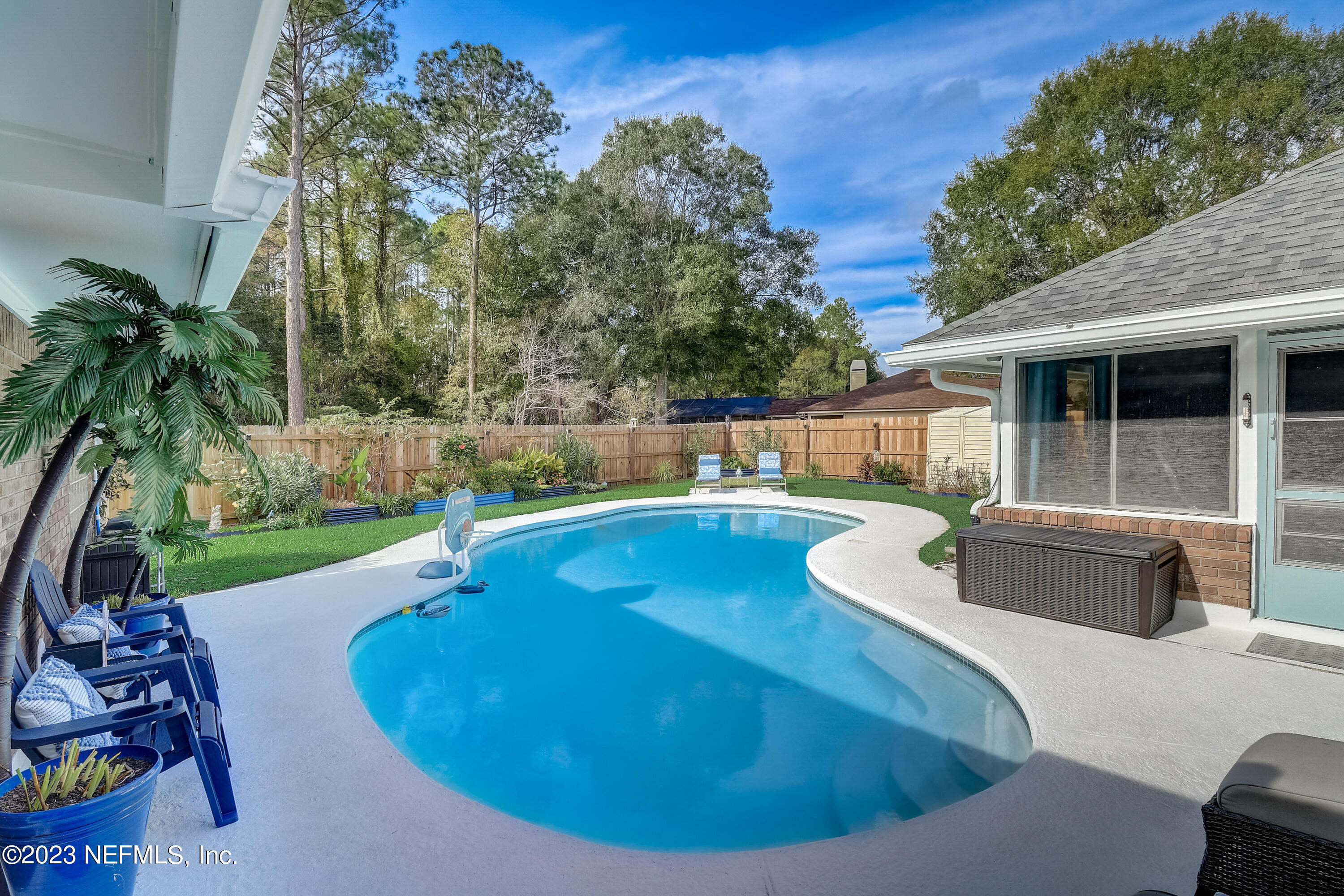 55377 Deer Run Road Callahan, FL 32011 - Photo 29 of 47 a view of a backyard with swimming pool