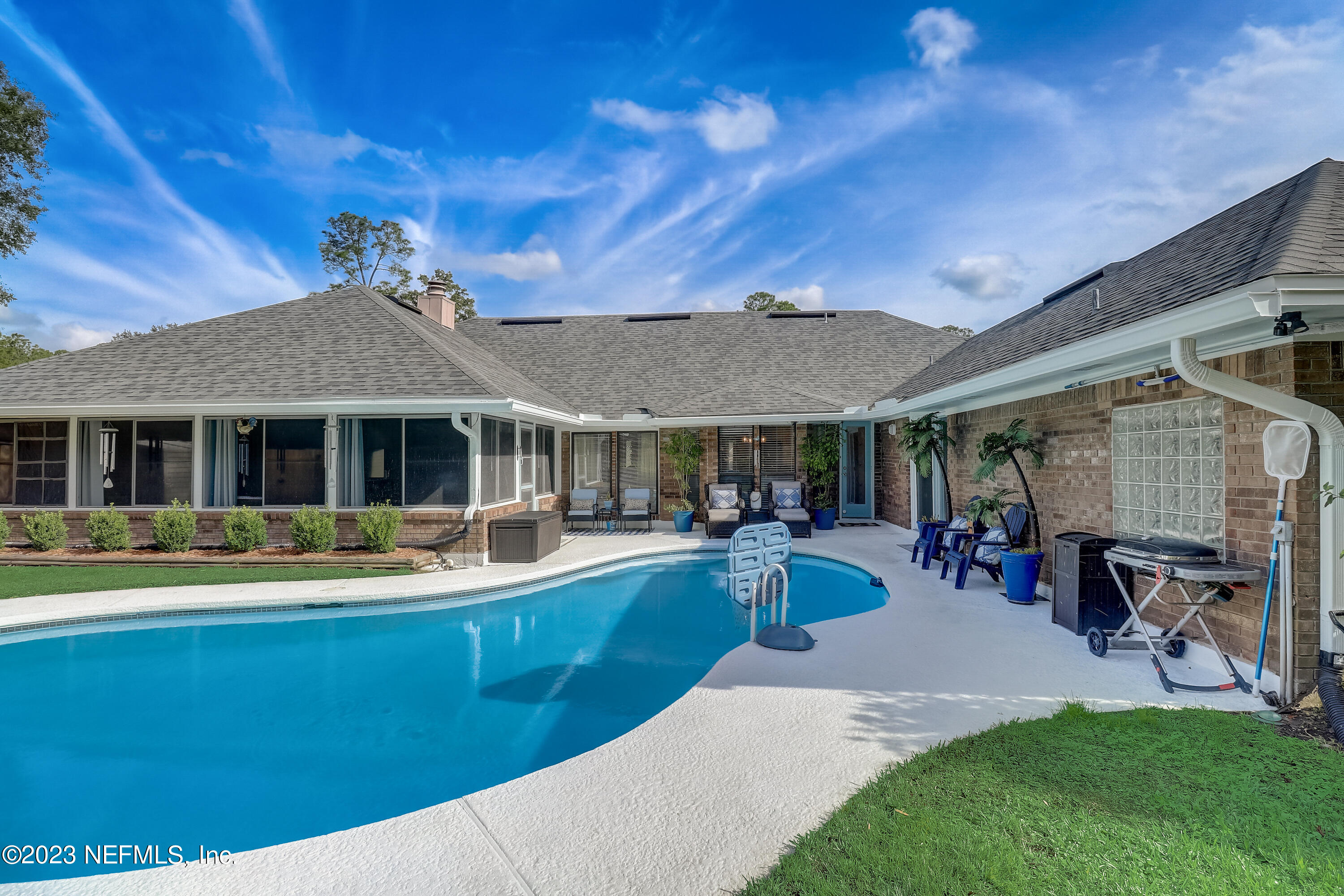 55377 Deer Run Road Callahan, FL 32011 - Photo 30 of 47 a view of a house with swimming pool and sitting area