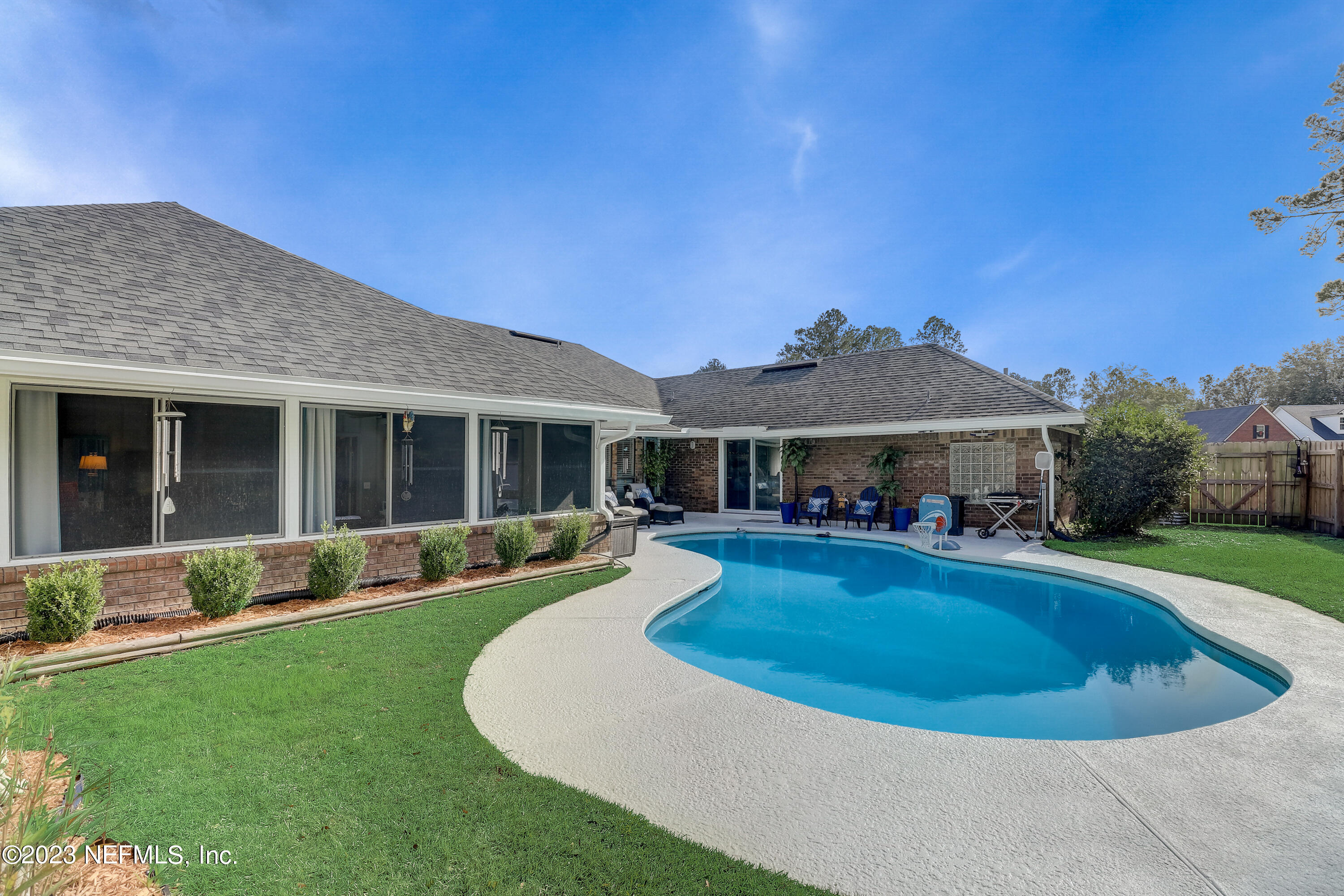 55377 Deer Run Road Callahan, FL 32011 - Photo 32 of 47 a view of a house with a swimming pool