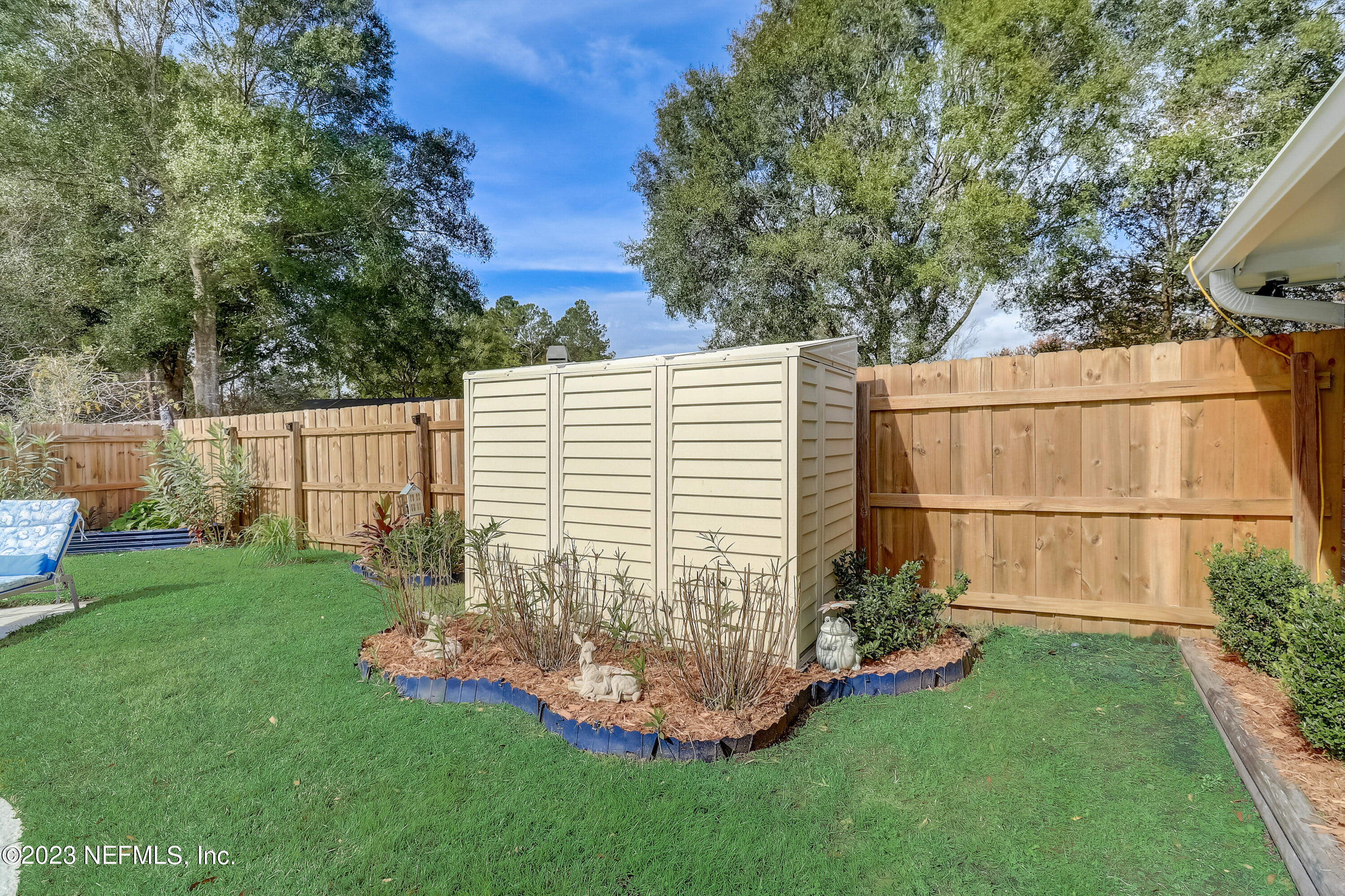55377 Deer Run Road Callahan, FL 32011 - Photo 34 of 47 a view of a backyard with plants and large trees