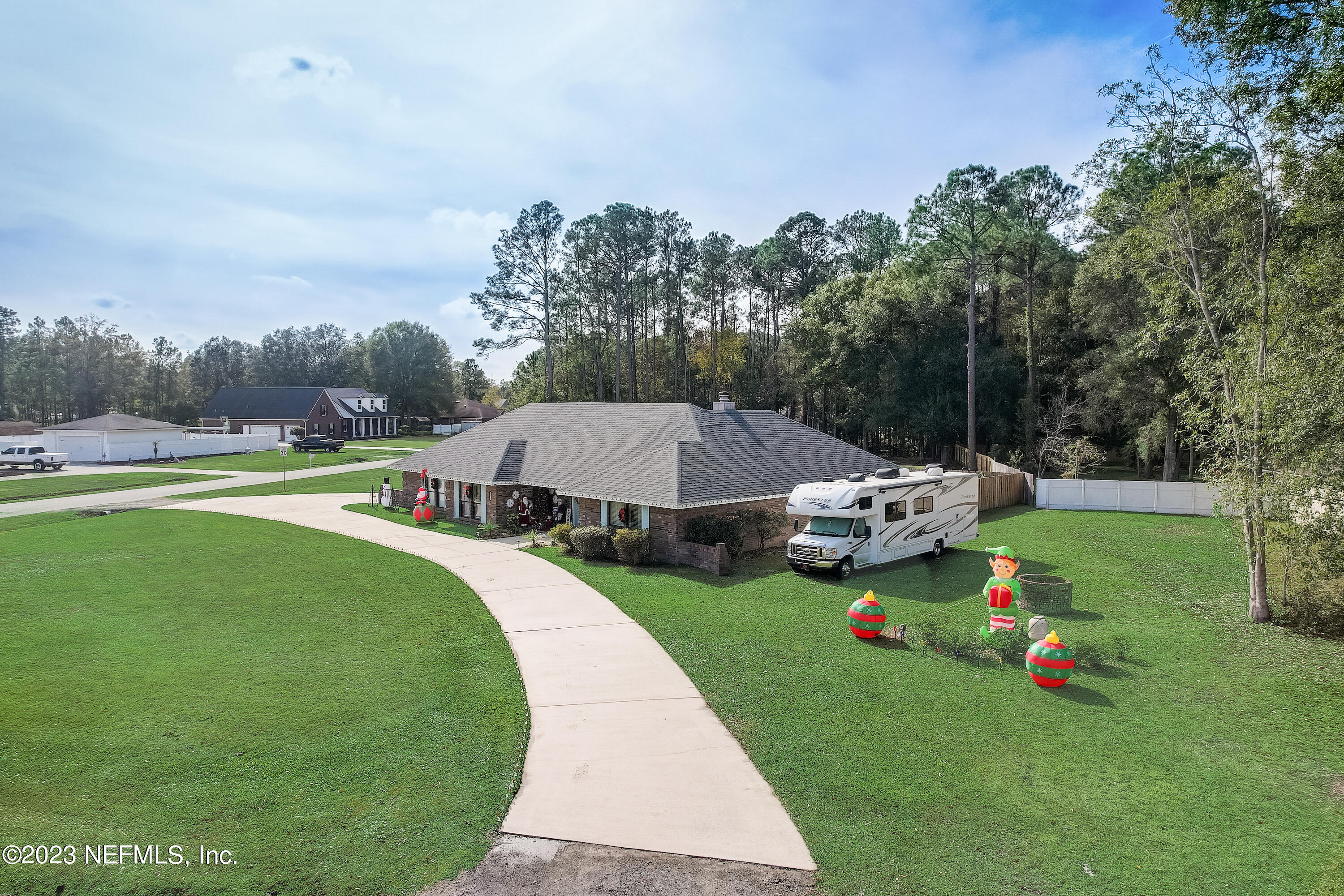 55377 Deer Run Road Callahan, FL 32011 - Photo 35 of 47 an aerial view of a house with swimming pool garden and trees