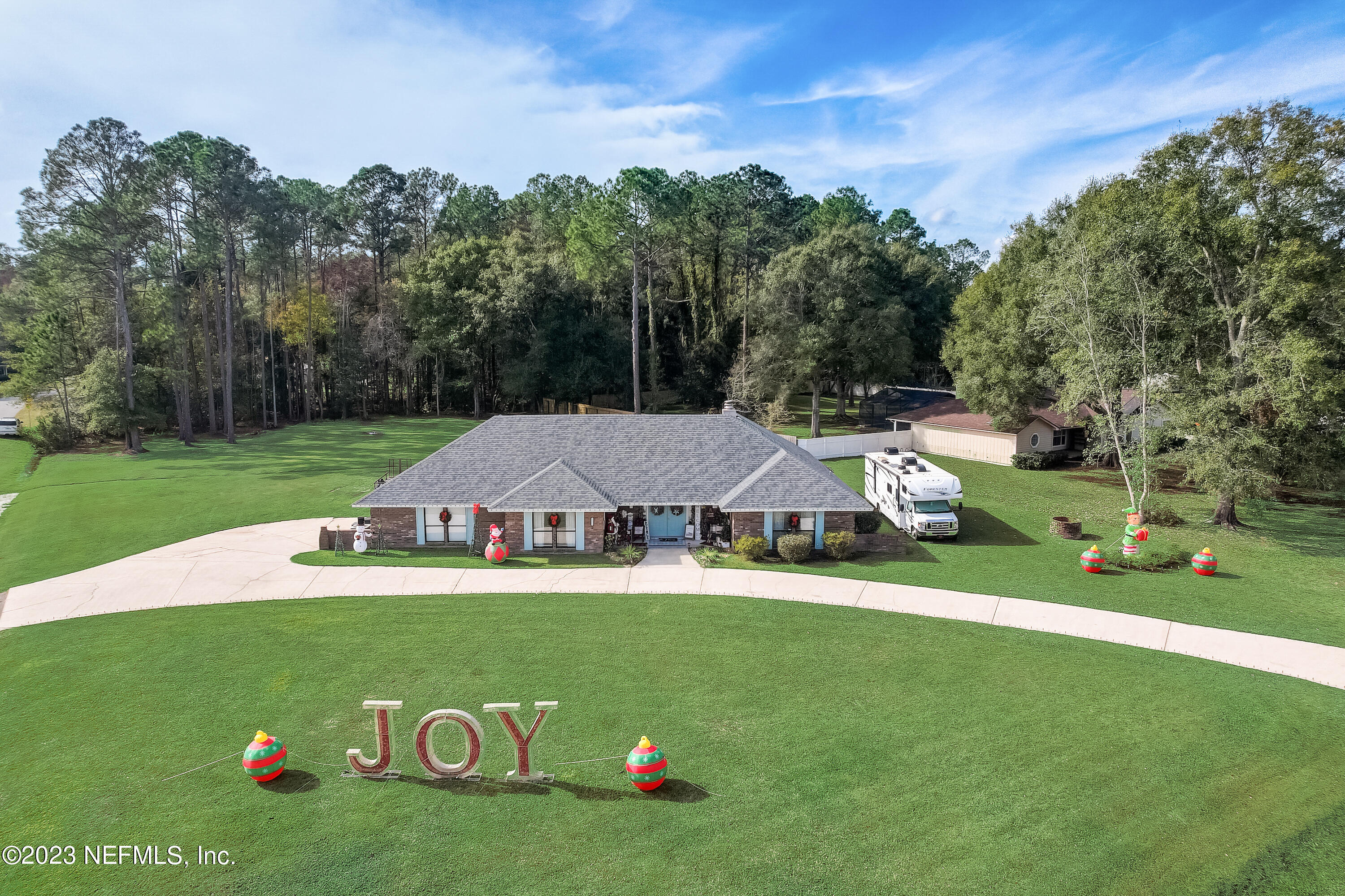 55377 Deer Run Road Callahan, FL 32011 - Photo 36 of 47 a view of house with garden space and trees