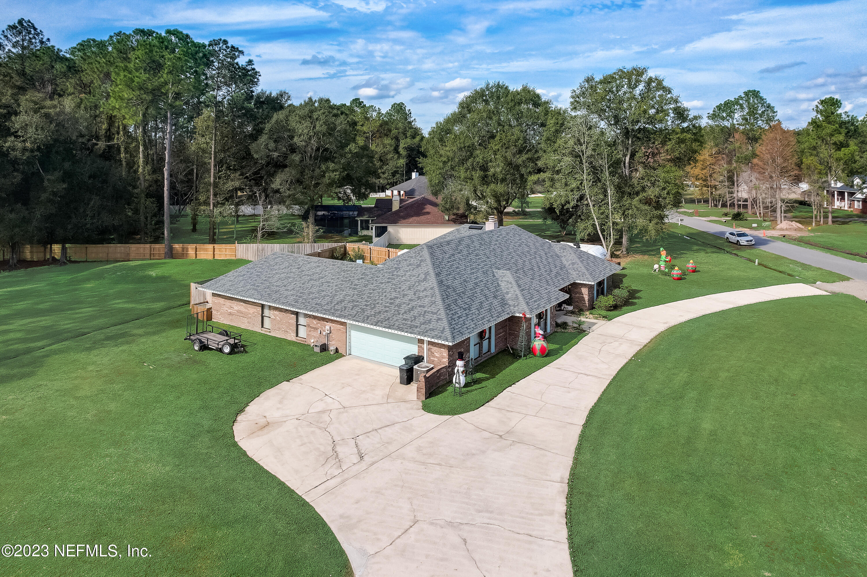 55377 Deer Run Road Callahan, FL 32011 - Photo 38 of 47 a view of a house with a yard porch and sitting area