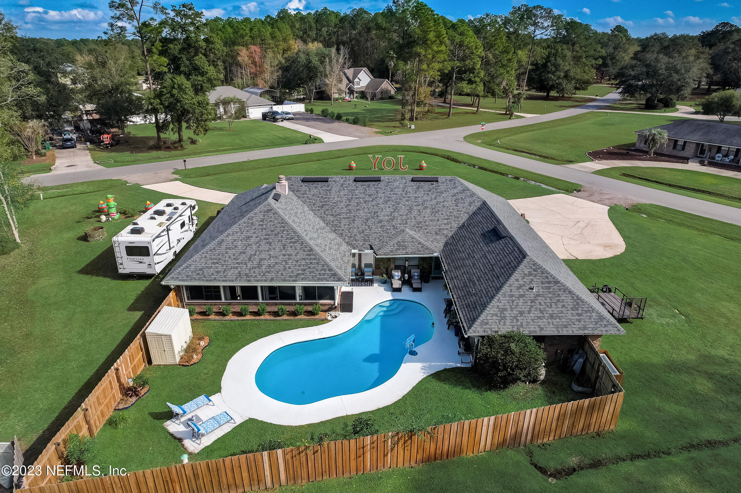 55377 Deer Run Road Callahan, FL 32011 - Photo 40 of 47 a aerial view of a house with swimming pool and big yard