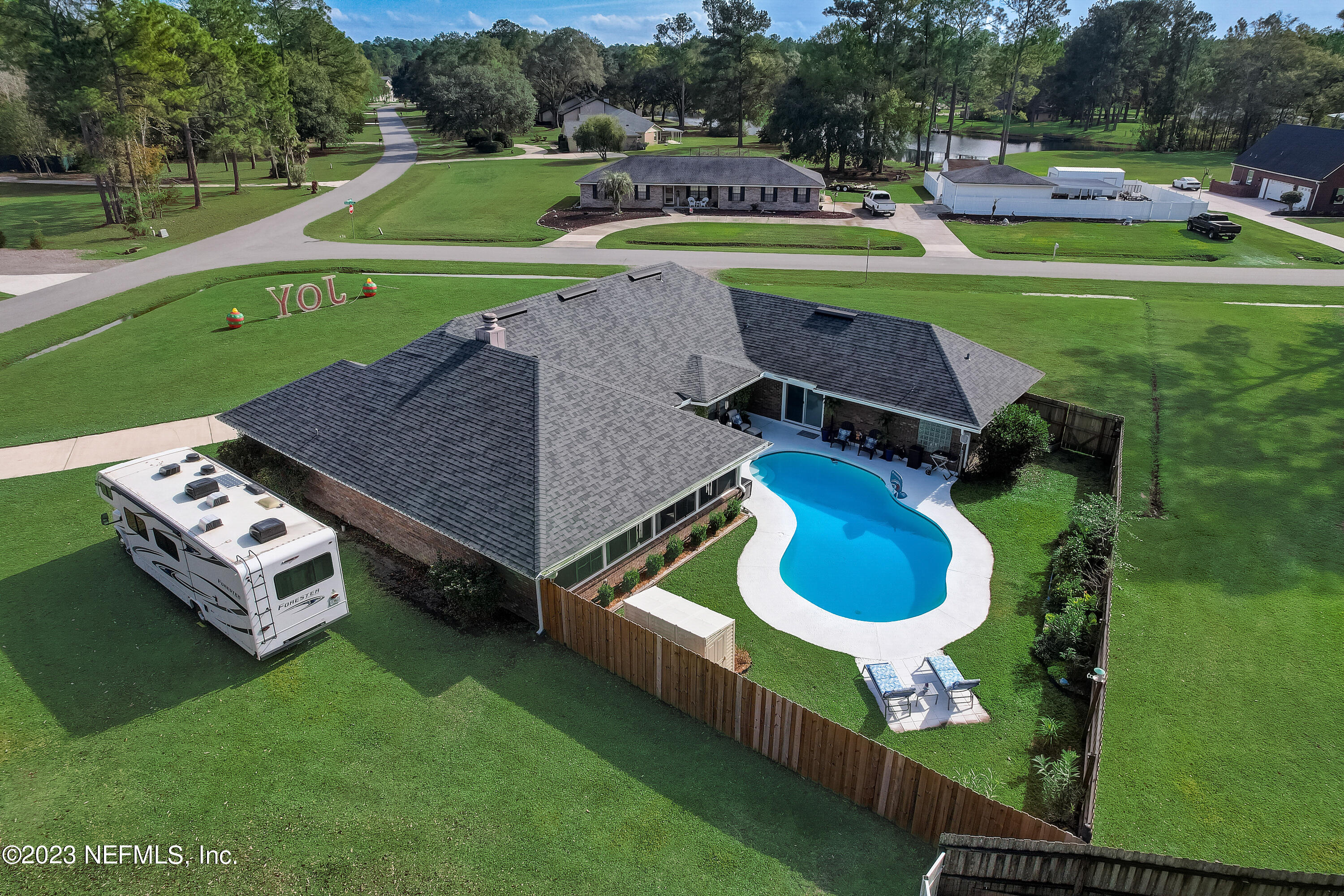 55377 Deer Run Road Callahan, FL 32011 - Photo 41 of 47 a aerial view of a house with a yard and a swimming pool