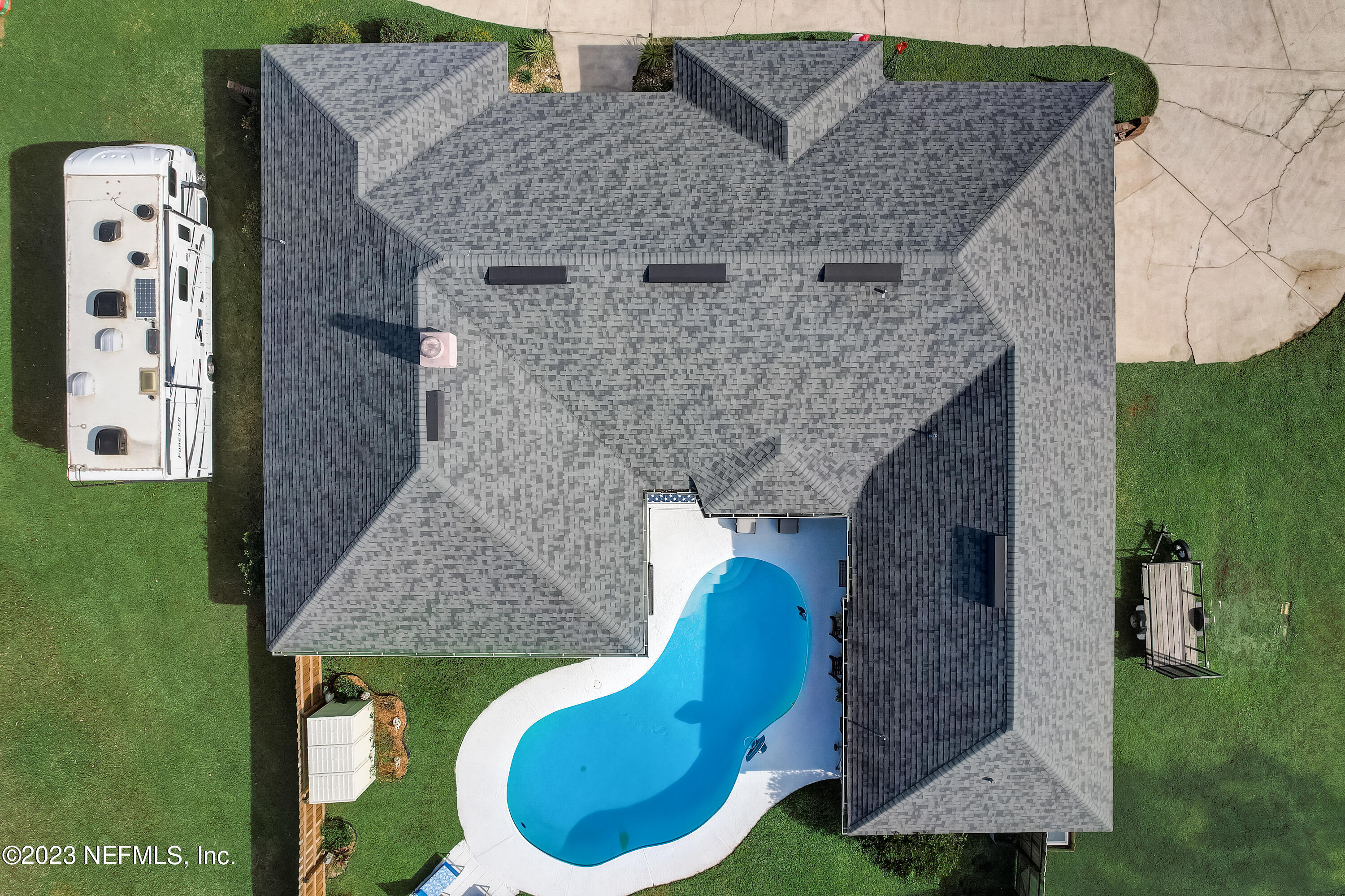 55377 Deer Run Road Callahan, FL 32011 - Photo 42 of 47 an aerial view of a house with swimming pool and garden view