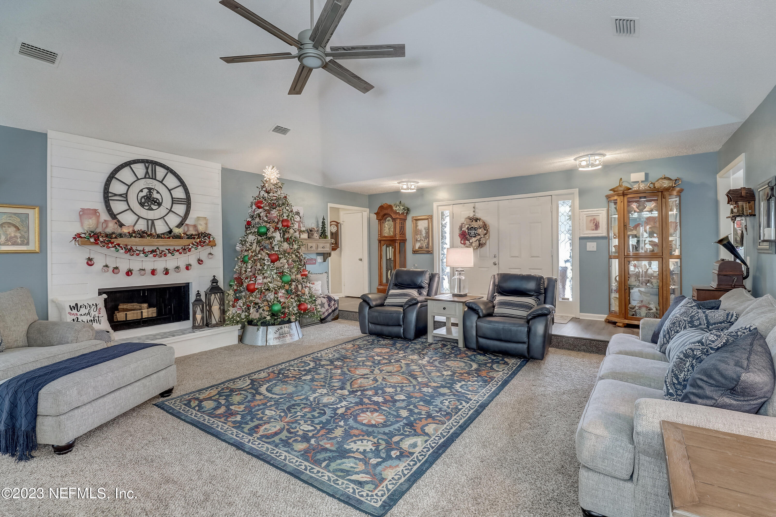 55377 Deer Run Road Callahan, FL 32011 - Photo 5 of 47 a living room with furniture and a fireplace